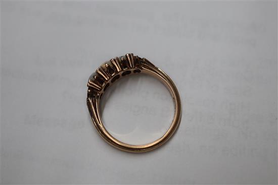 A Victorian 15ct, graduated white opal, split pearl and topaz? set half hoop ring, size O.